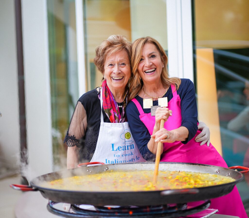 Owner of Belvedere Bike Hotel cooking up family-style dinner 